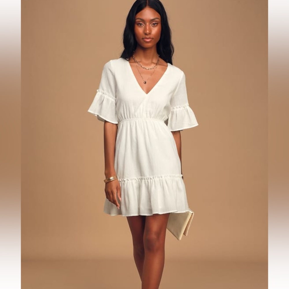 Lulu’s Sunshine Daydream White Short Sleeve
Cutout Mini Dress